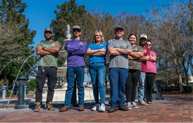The Southern Heating and Air Conditioning employees standing together and smiling