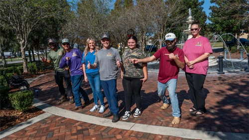 The employees of Southern Heating and Air Conditioning standing together and laughing