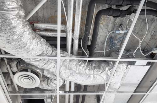 HVAC duct cleaning equipment removing dust buildup