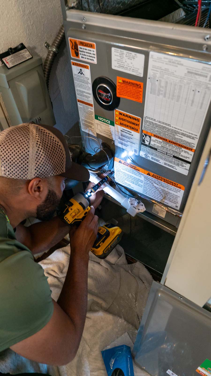 HVAC tech performing maintenance on a system in Plant City