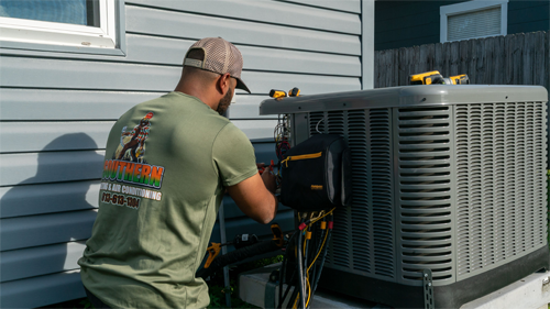 HVAC technician servicing residential air conditioning system in Plant City
