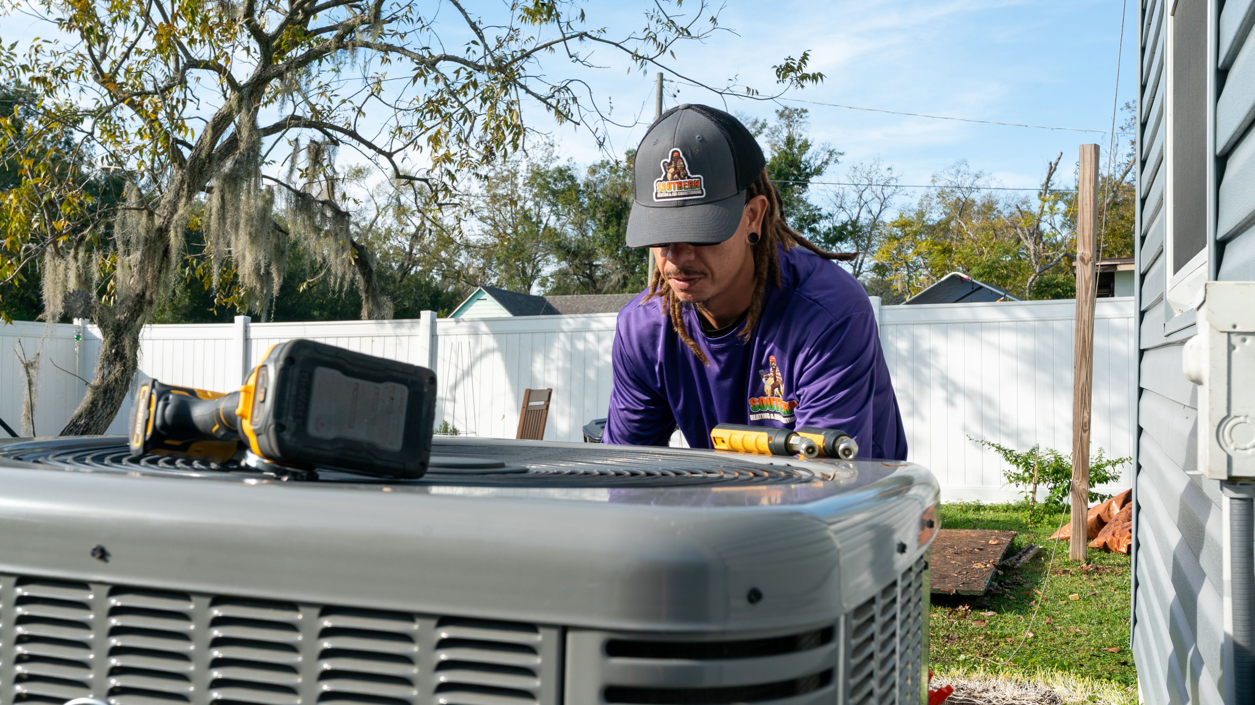 HVAC technician inspecting an air conditioning system in Seffner, Florida