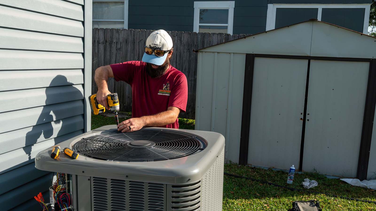 HVAC technician servicing an air conditioning unit in Lakeland, Florida